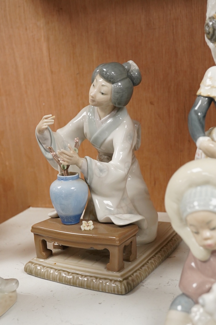 A collection of five Lladro figures, largest 24cm high